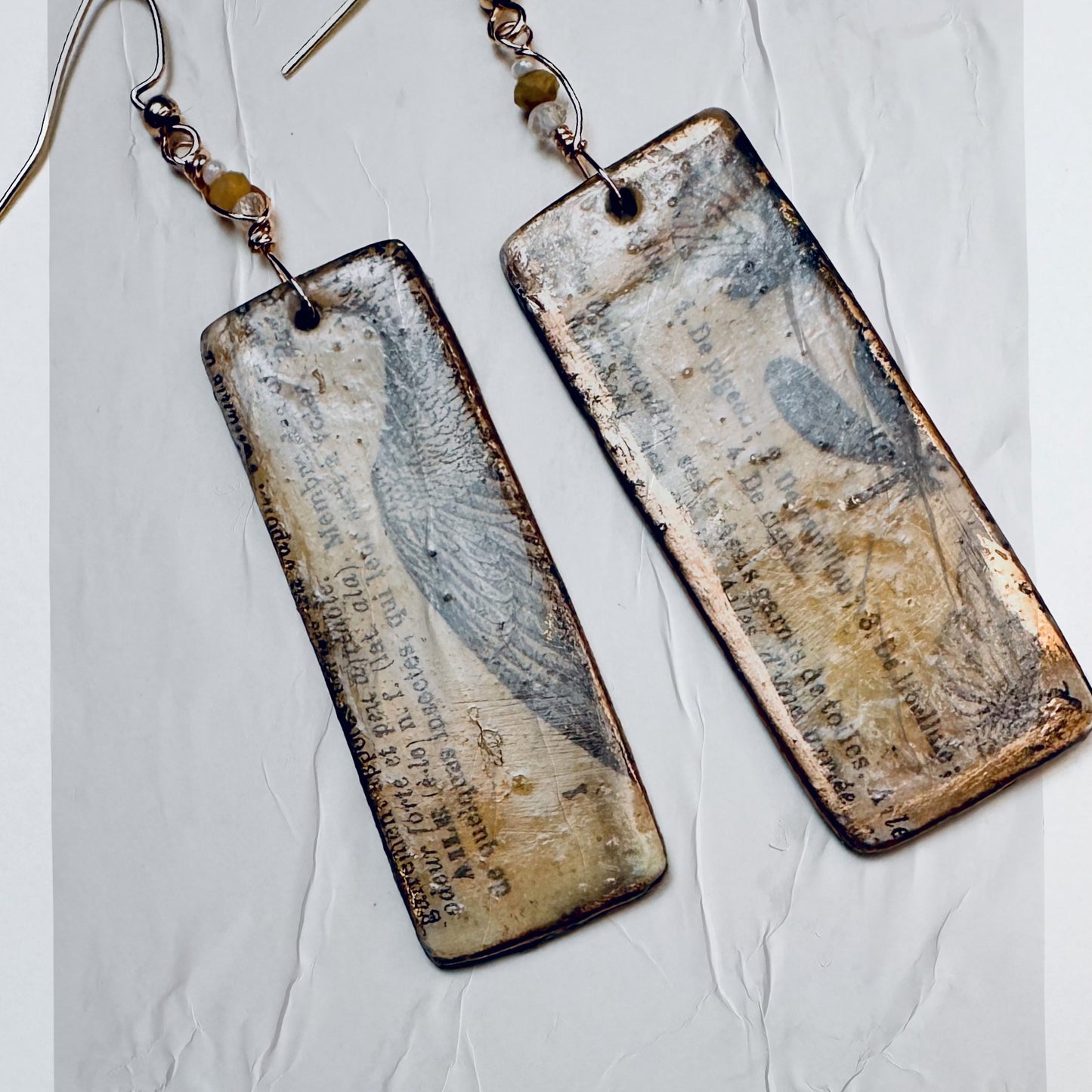 Palimpsest Relic Earrings Aged Text & Wing Motif in Resin & Patina