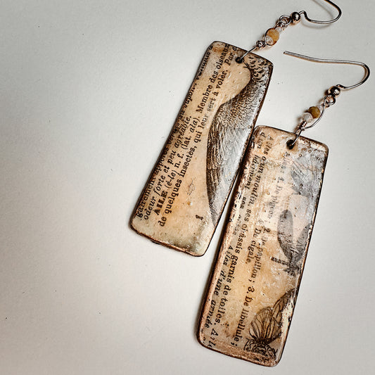 Palimpsest Relic Earrings Aged Text & Wing Motif in Resin & Patina