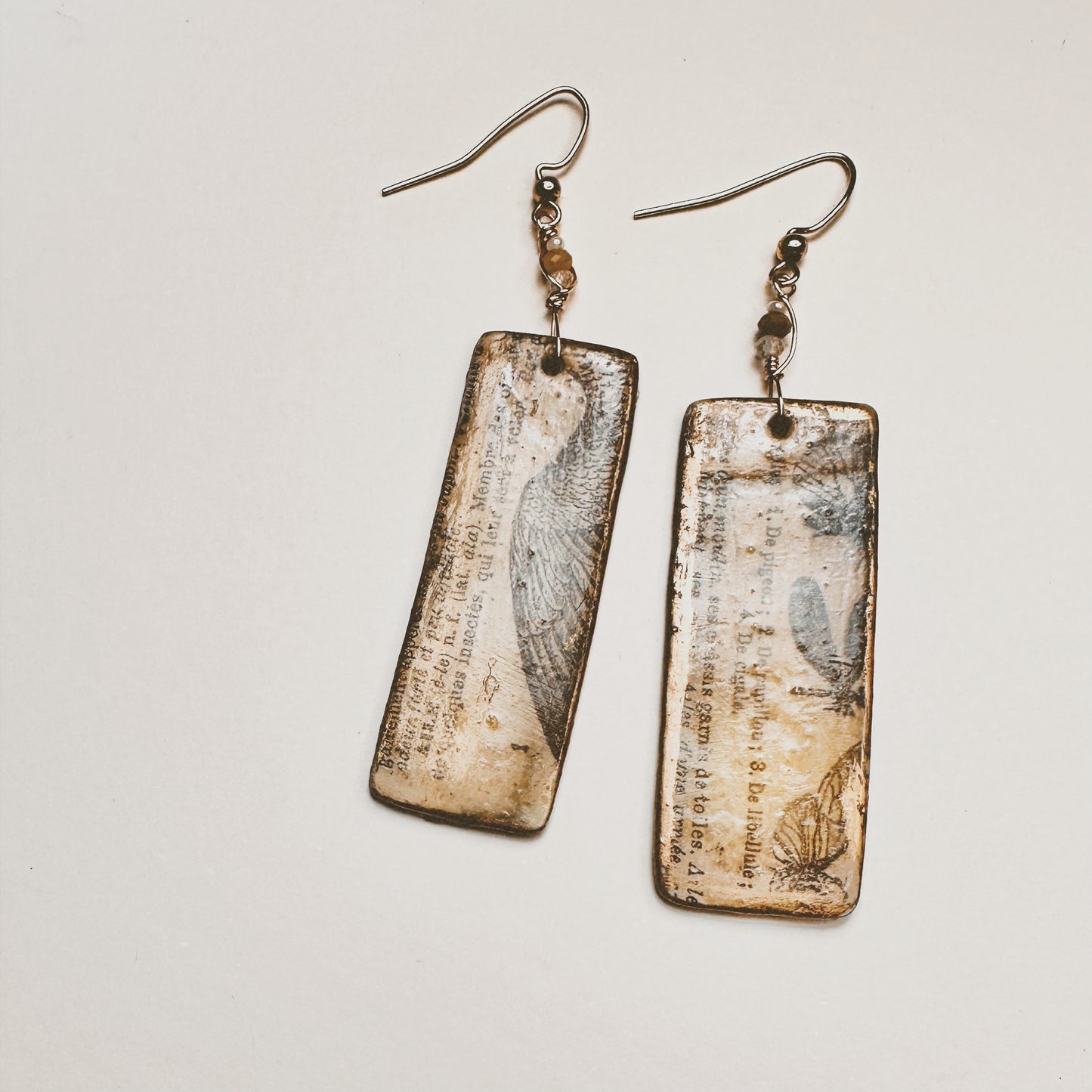 Palimpsest Relic Earrings Aged Text & Wing Motif in Resin & Patina