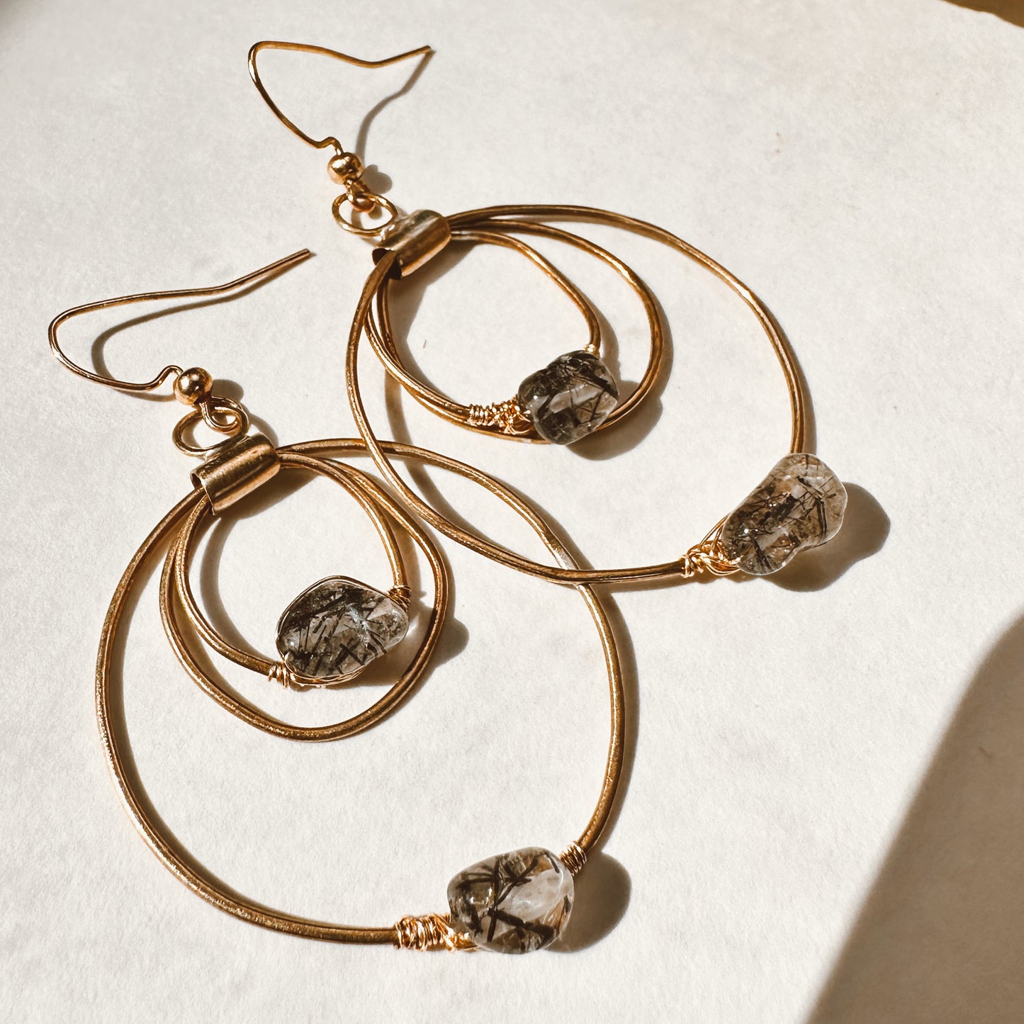 Celestara Eclipse Black Tourmaline Rutilated Quartz Earrings Hand-Forged Brass Hoops